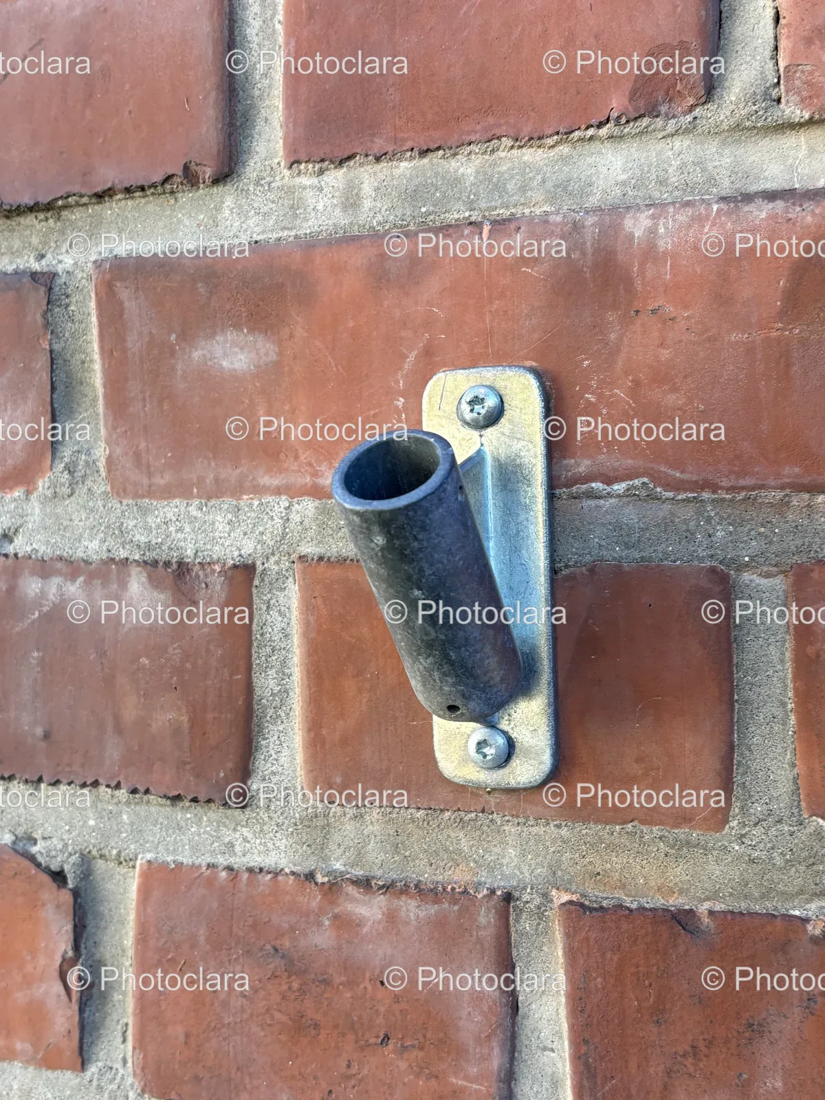 Metal-Pipe-on-Brick-Wall.jpg