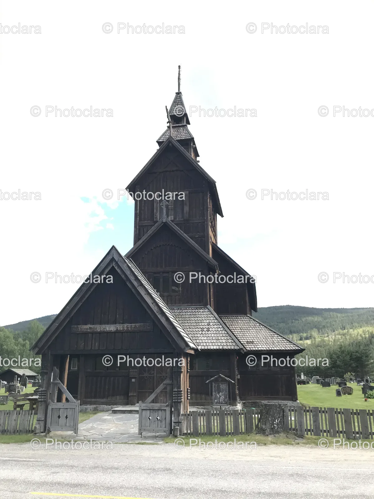 Wooden-Church-with-Fence-and-Hill.jpg