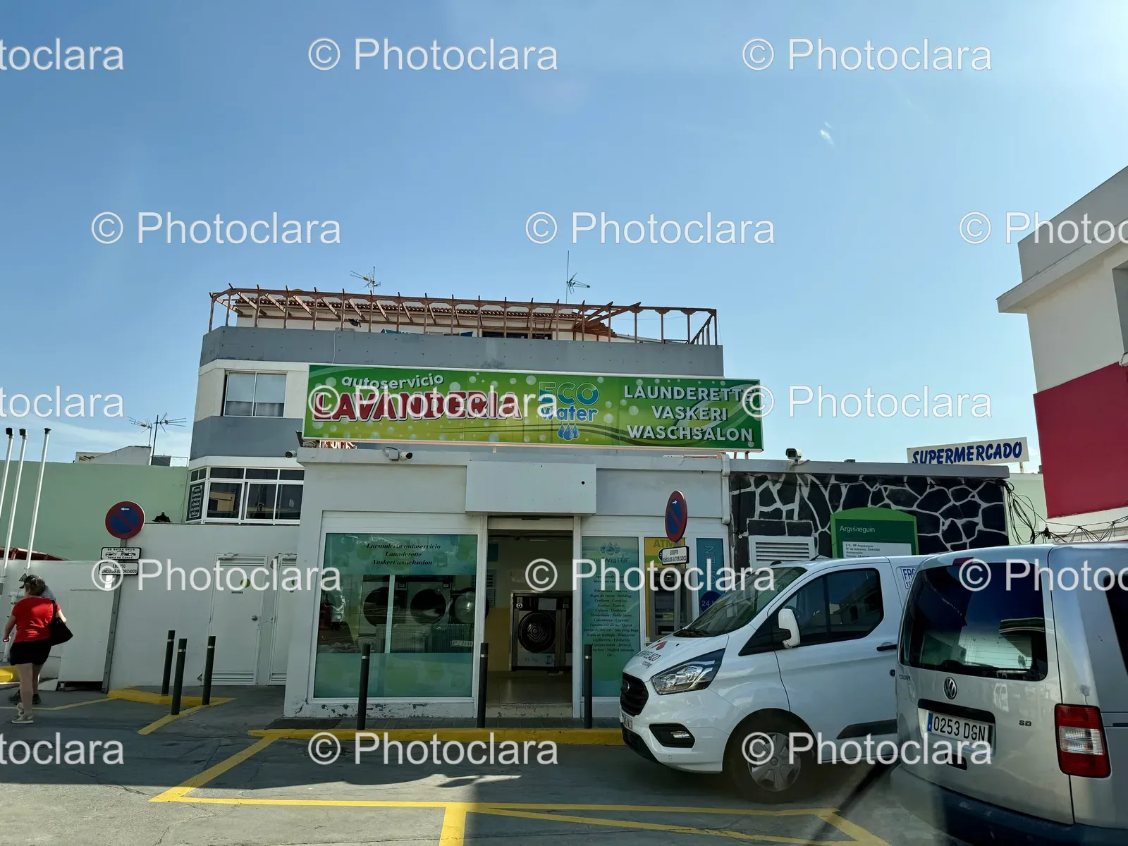 Lively Commercial Building with Parked Cars