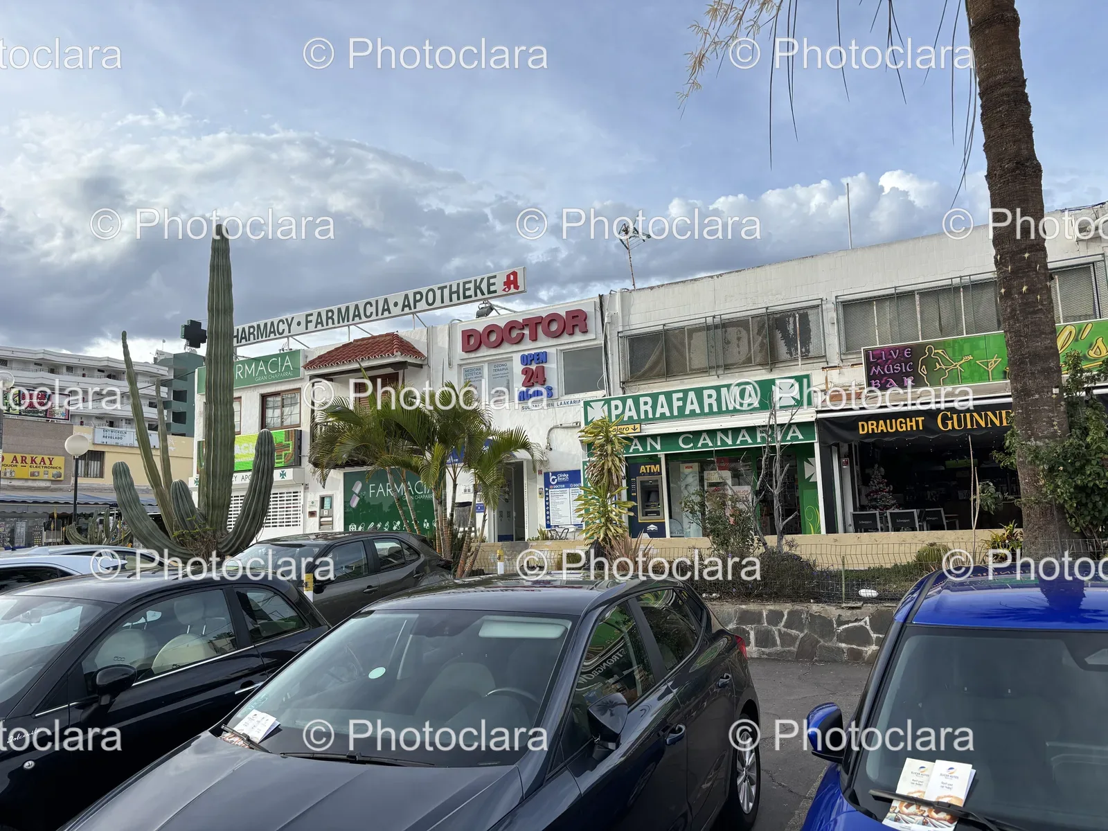 Pharmacy Facade with Parked Cars