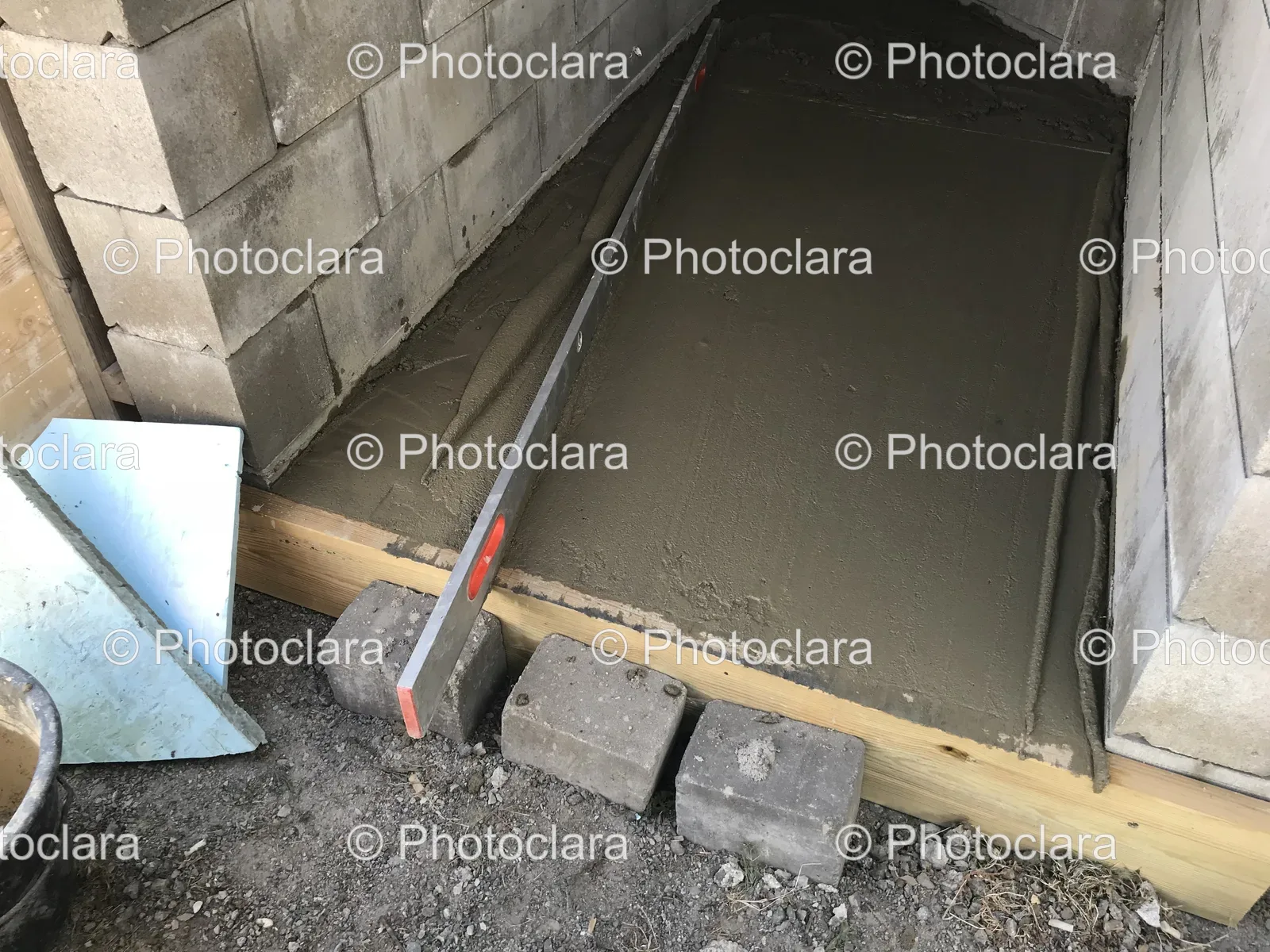 Concrete-Slab-Next-to-Brick-Wall.jpg
