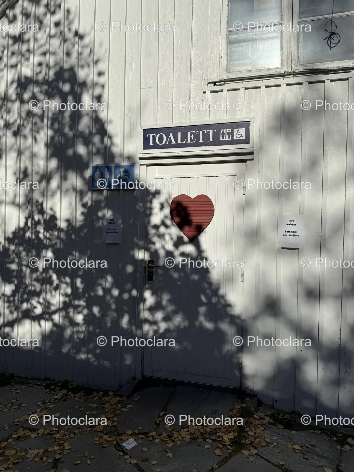 Charming-White-Building-with-Heart-on-Door.jpg