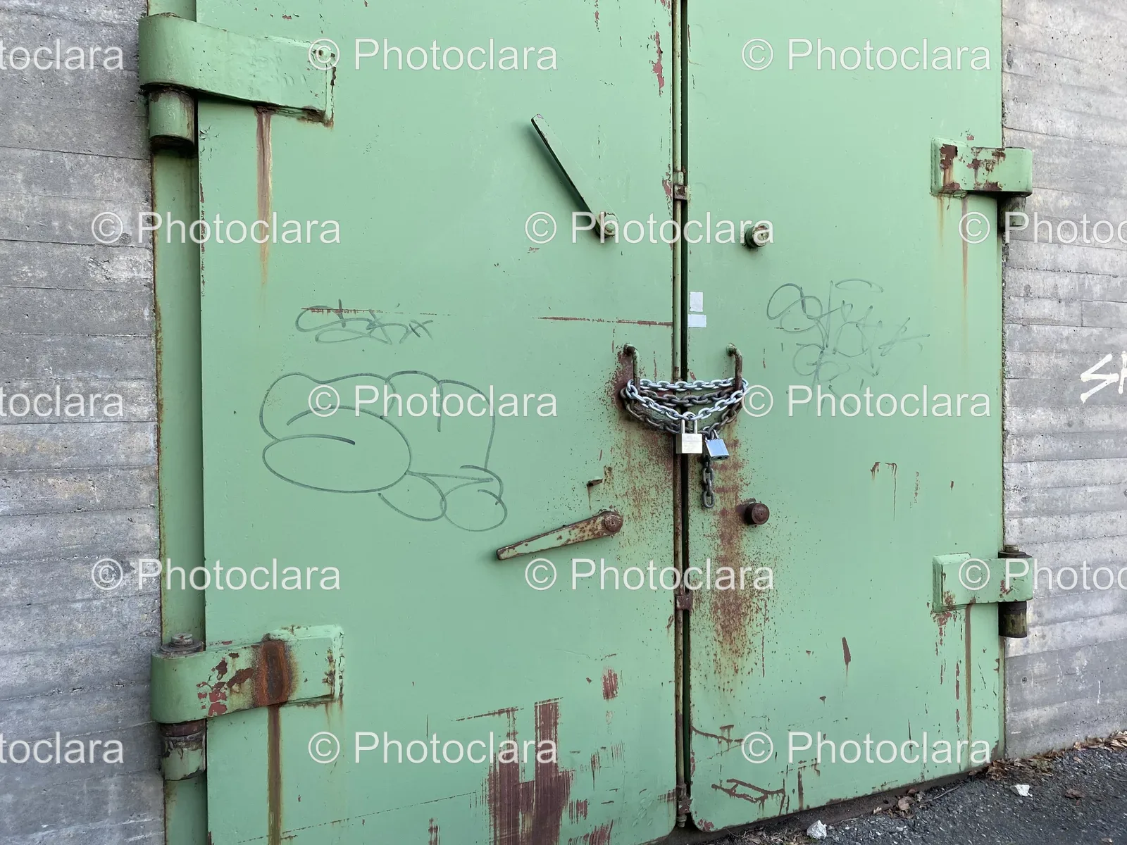 green-metal-door-with-a-lock.jpg