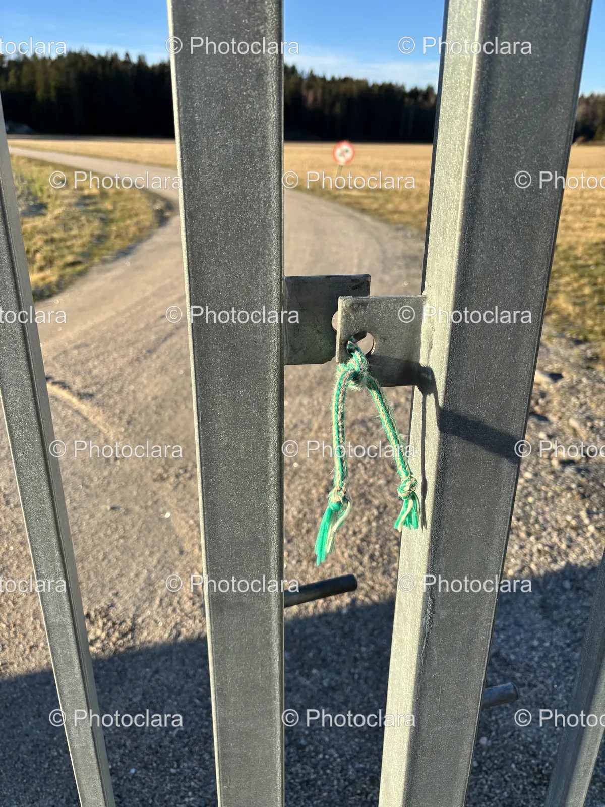 quaint-iron-gate-with-green-rope.jpg