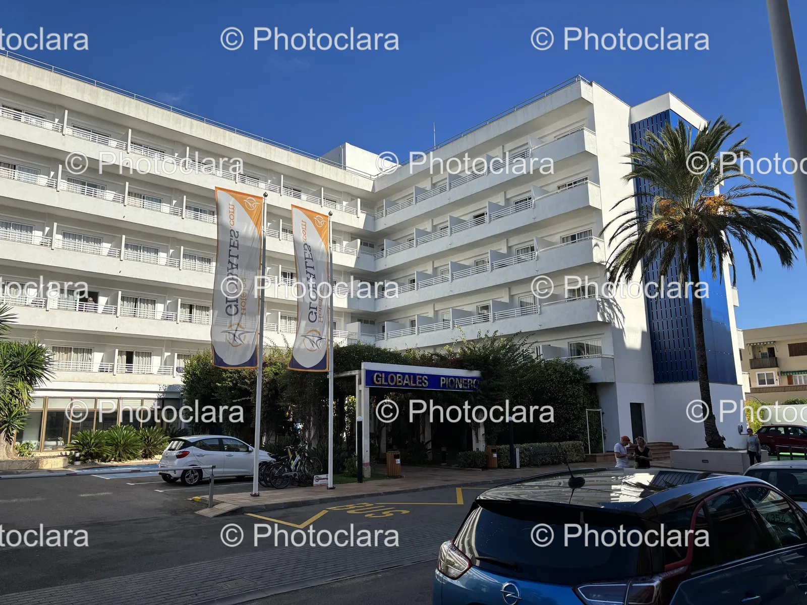 Charming-White-Building-with-Blue-Car.jpg