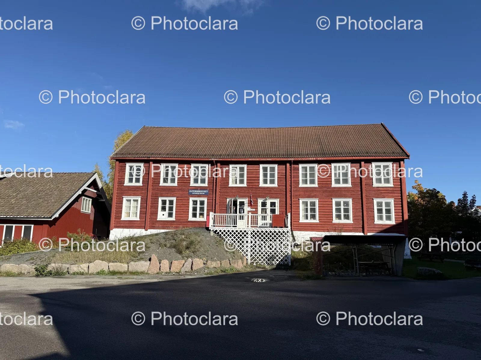 Charming-Red-House-with-White-Fence.jpg
