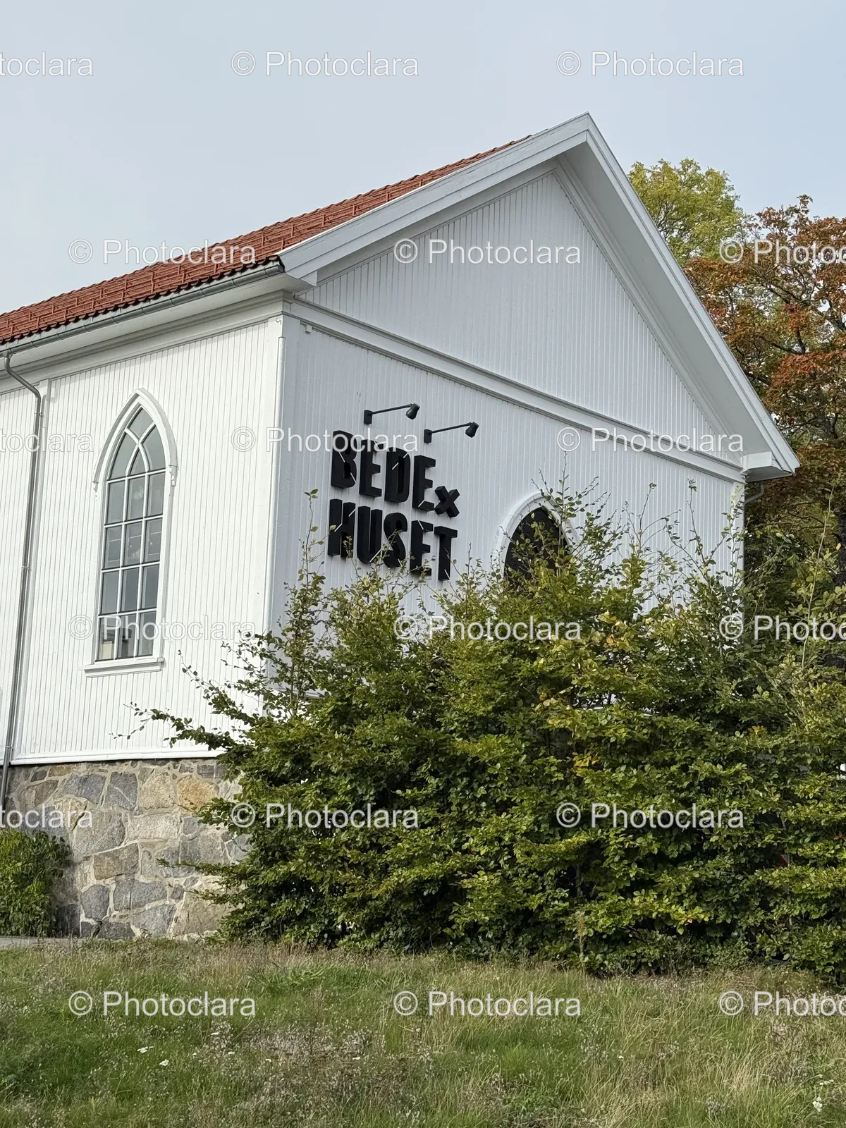 Charming-White-Building-Red-Roof-Stone-Wall.jpg