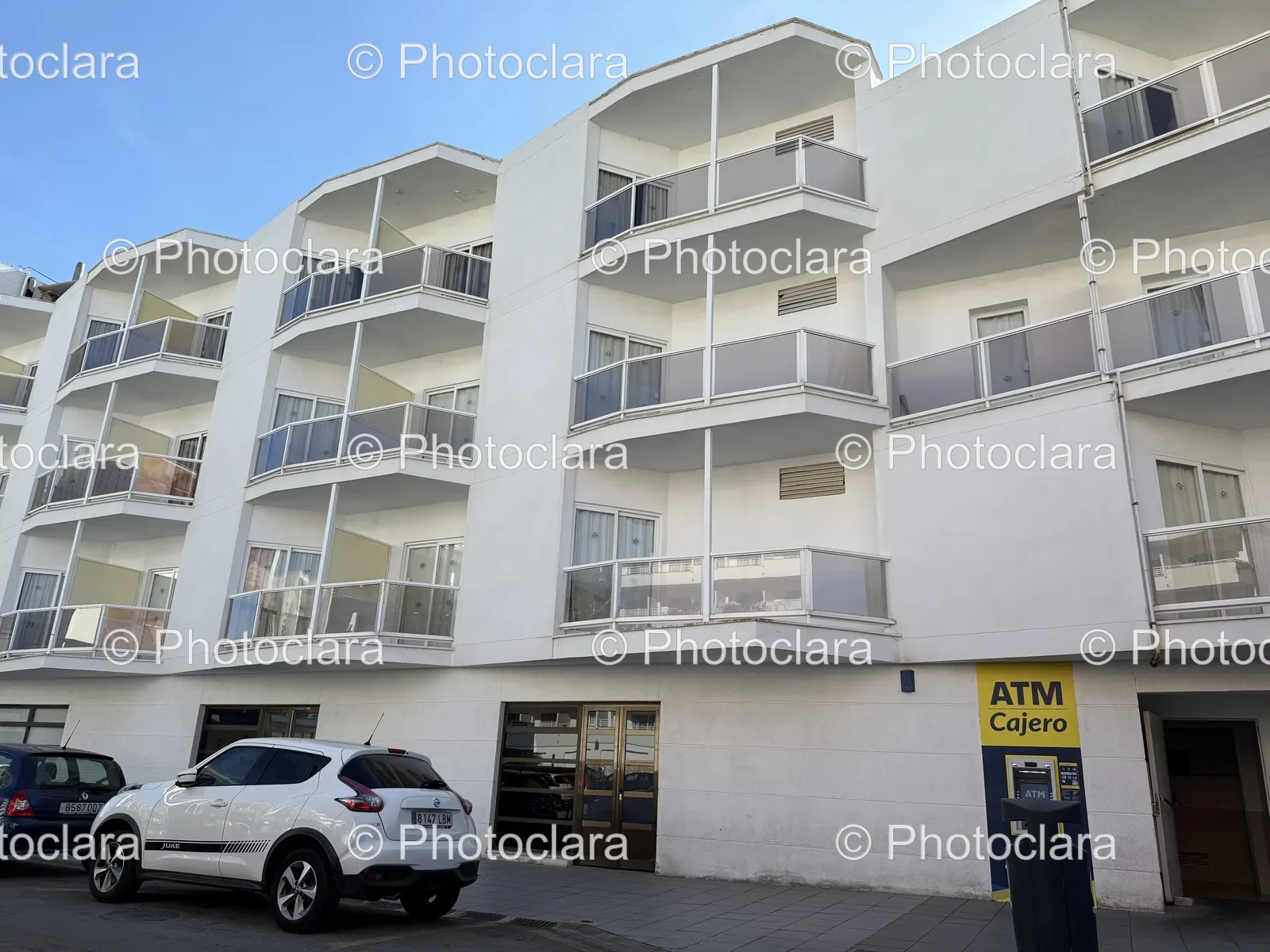 Charming-White-Building-with-Balconies.jpg