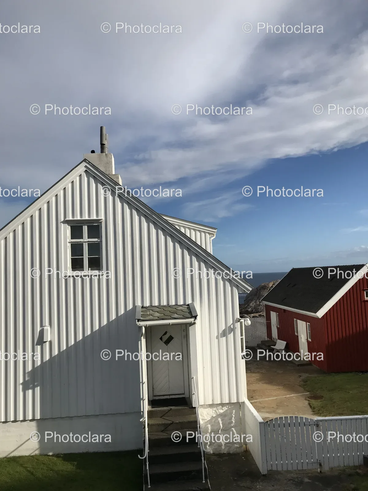 Charming-White-House-with-Red-Building-and-White-Fence.jpg