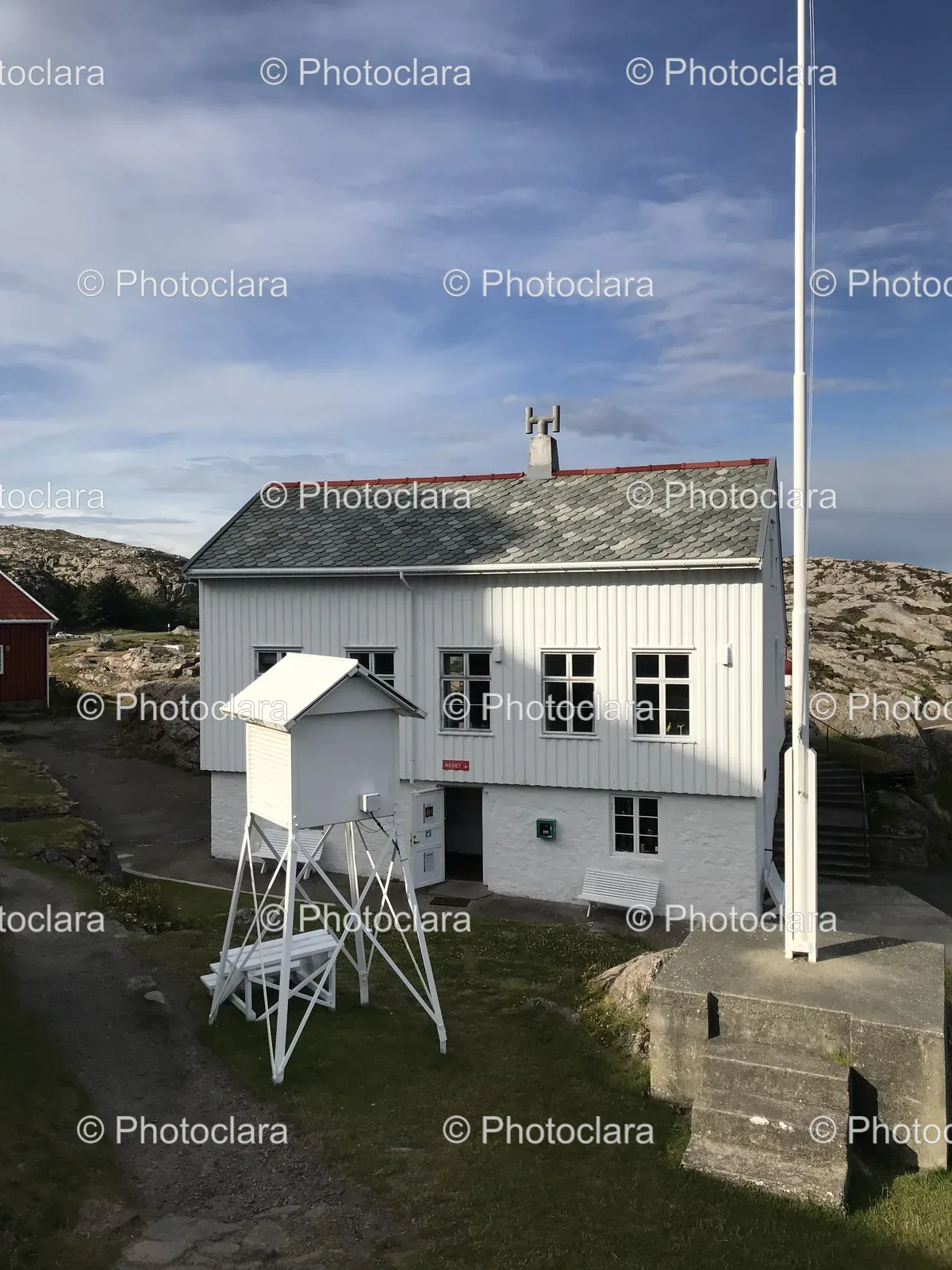 Elegant-White-Building-with-Tower-and-Flag-Pole.jpg