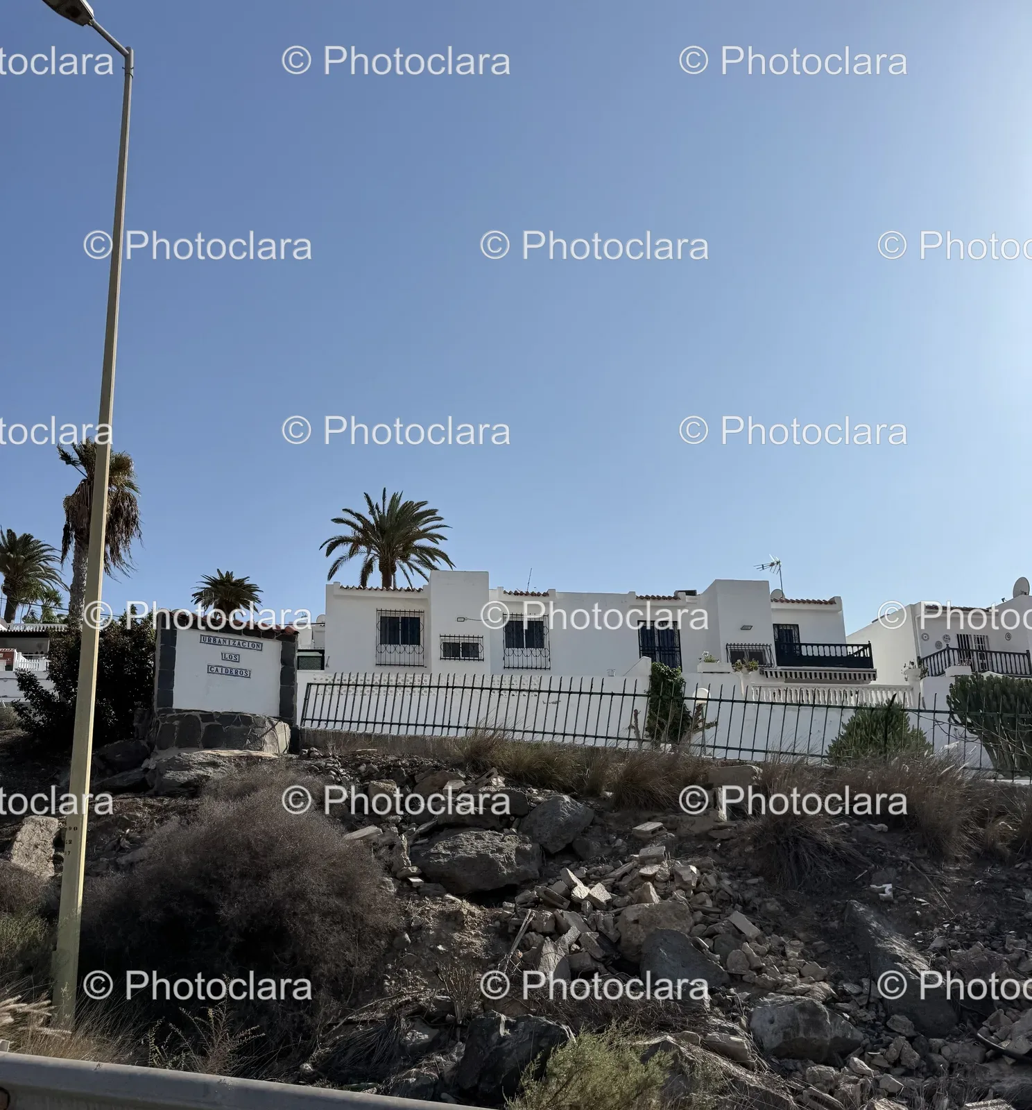 White-Building-On-Hill-With-Trees-And-Rocks.jpg