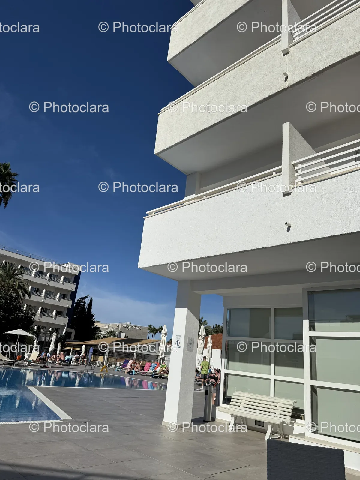 Serene-Poolside-Near-Hotel-Building.jpg