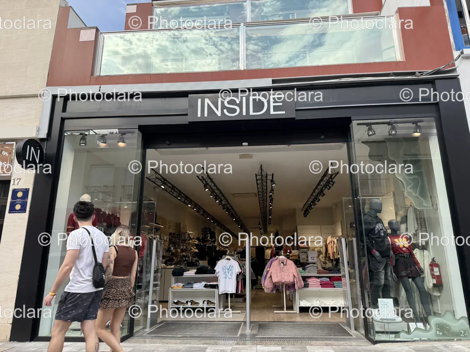 Vibrant Storefront with Walking Pedestrians