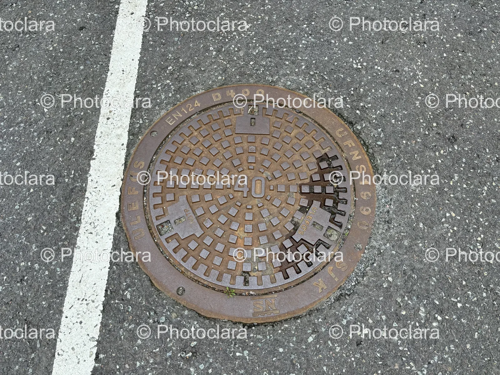 Intricate-Personhole-Cover-on-Road.jpg