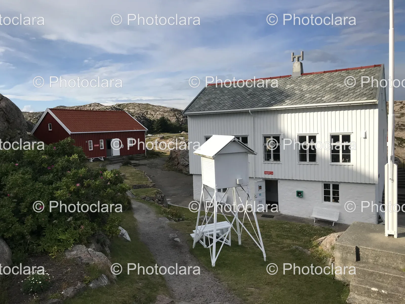 white-building-with-tower-amidst-scenic-landscape.jpg