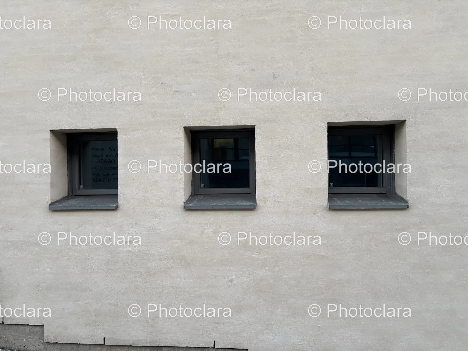 Row-of-Small-Windows-Grey-Wall.jpg