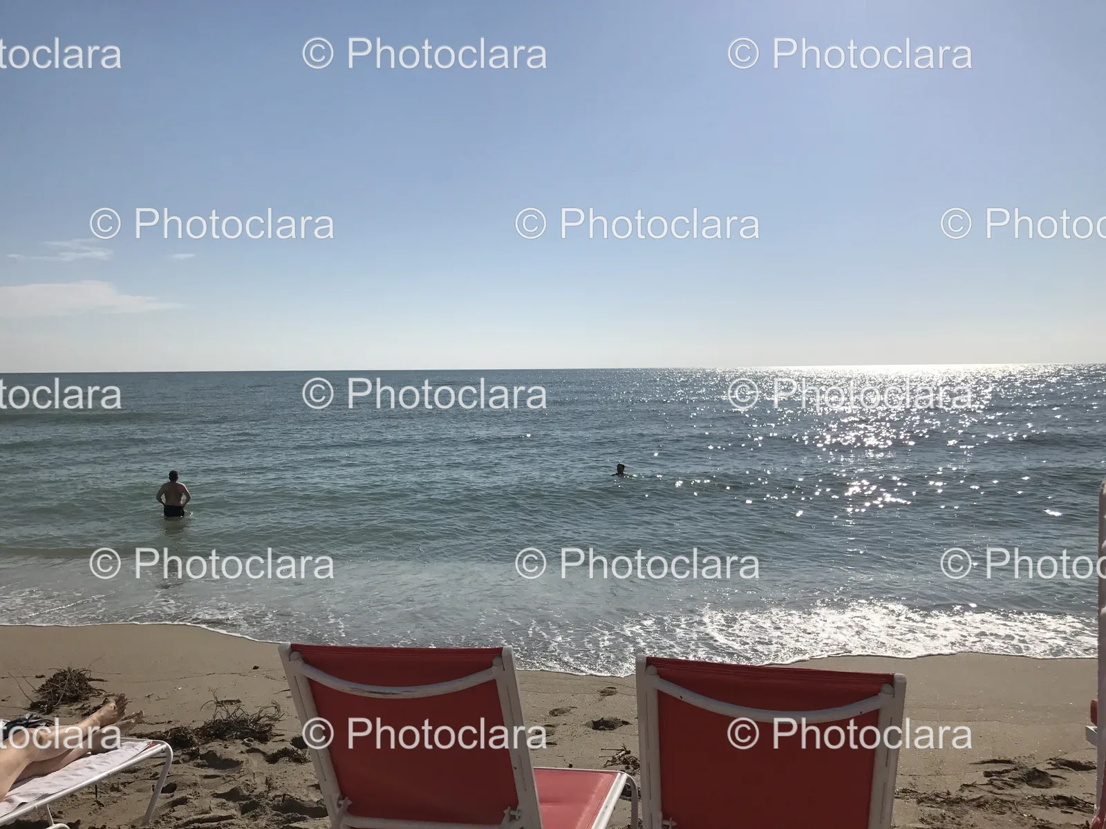 relaxing-beach-chairs-on-sandy-shore.jpg