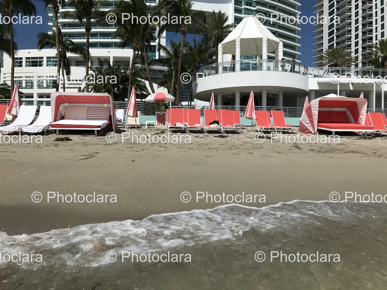 Serene-Beach-Setting-with-Chairs-and-Umbrellas.jpg