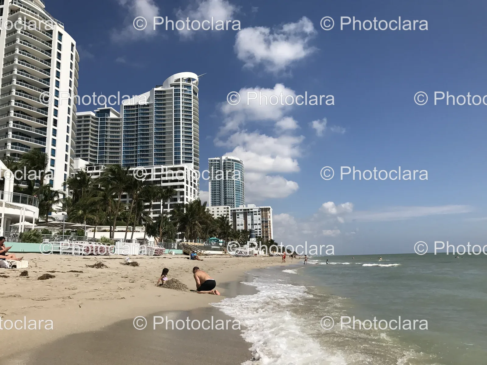 Serene-Beach-with-Buildings-Trees.jpg