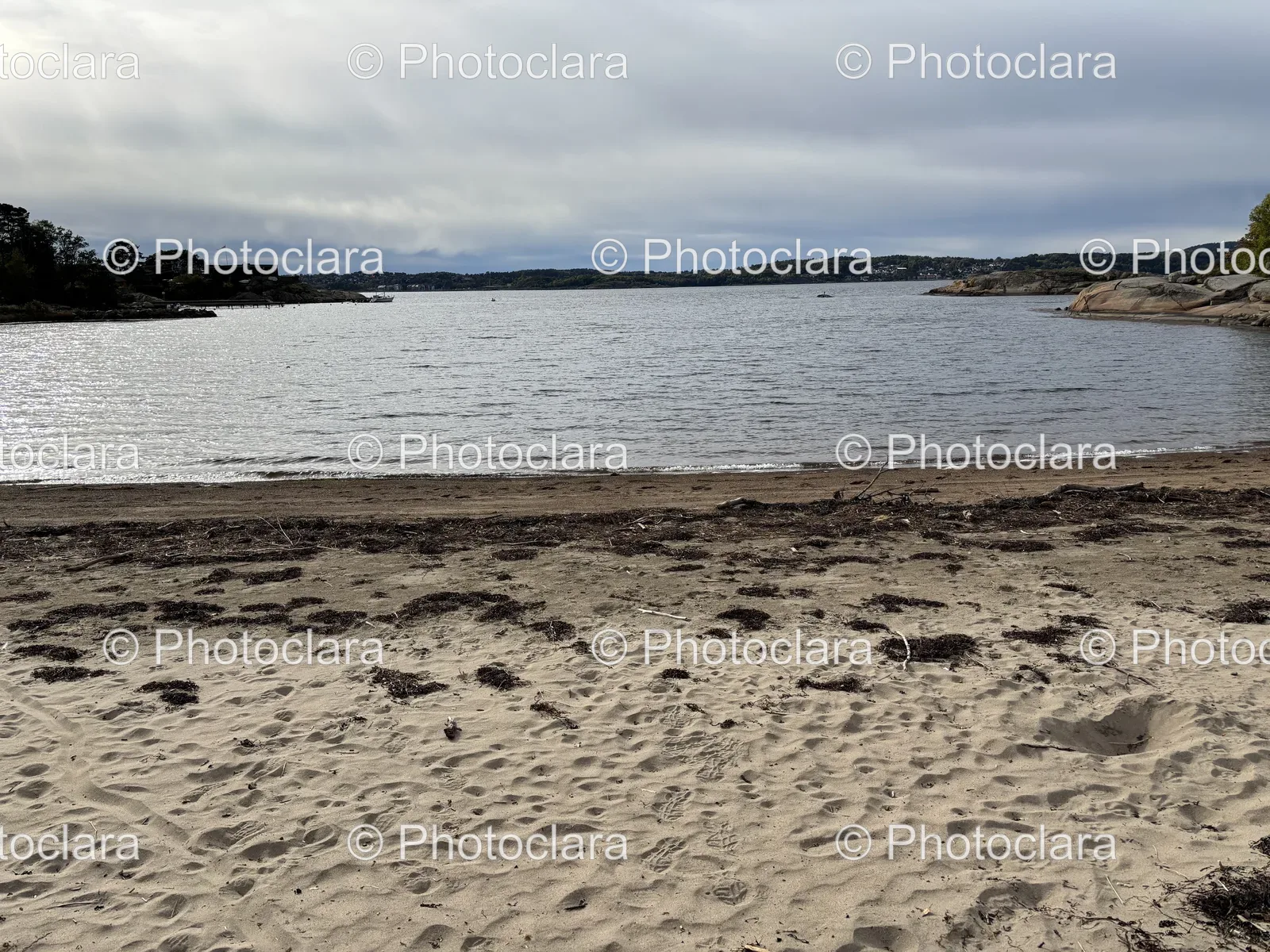 Serene-Beach-with-Water-and-Clouds.jpg
