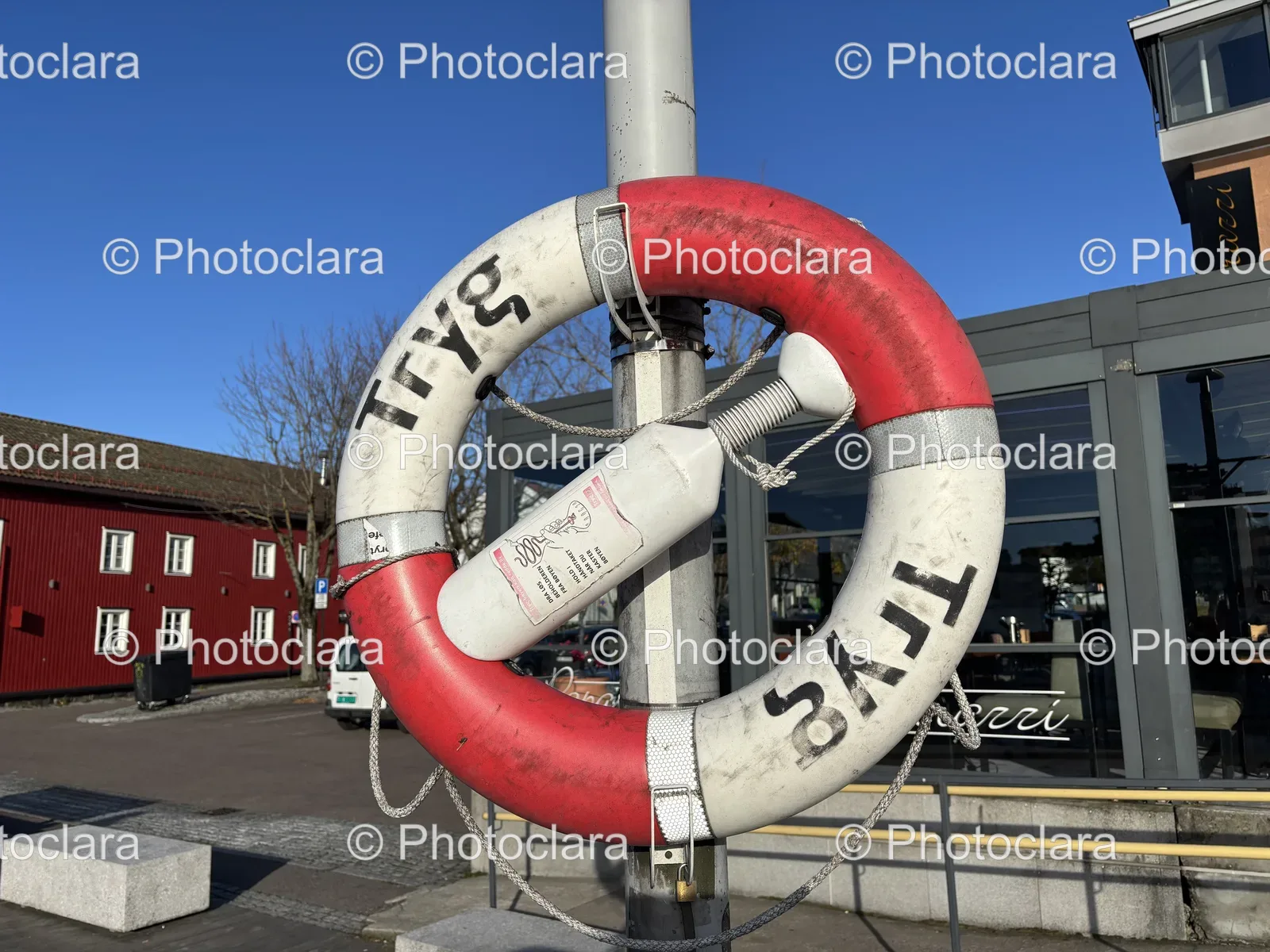 Red-and-White-Life-Preserver-on-Pole.jpg