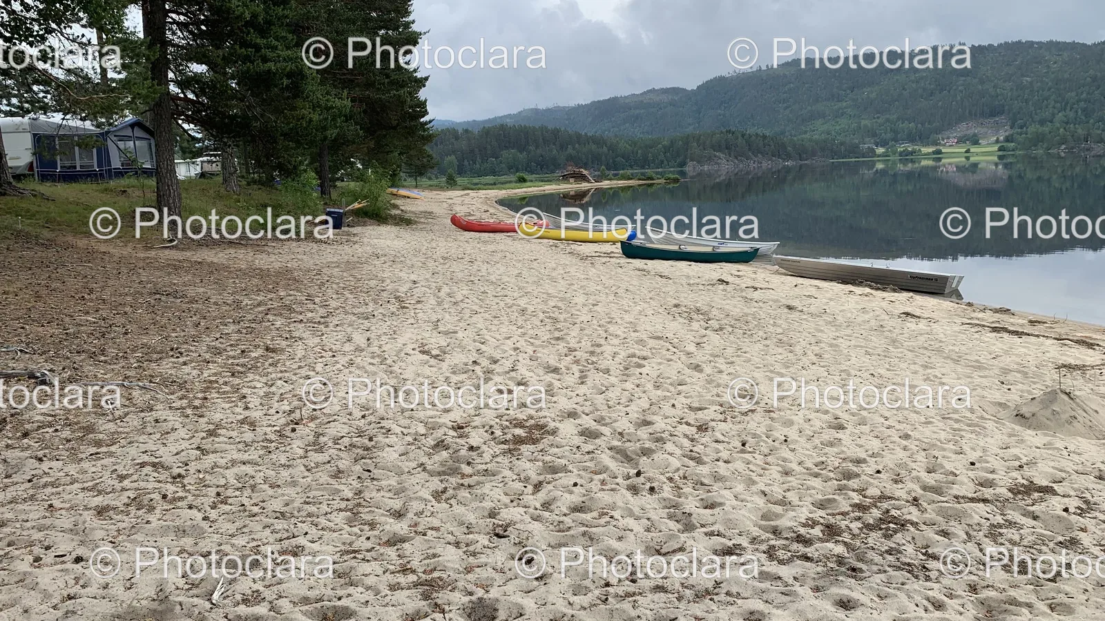 Canoes-Lined-Up-on-a-Serene-Beach.jpg