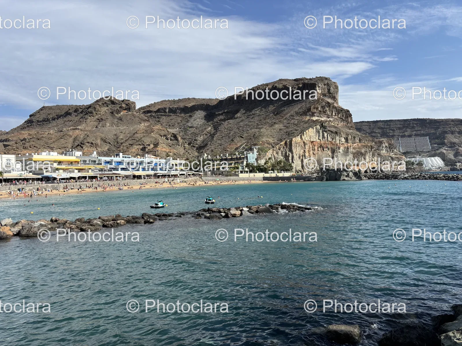 serene-rocky-beachfront-with-buildings.jpg