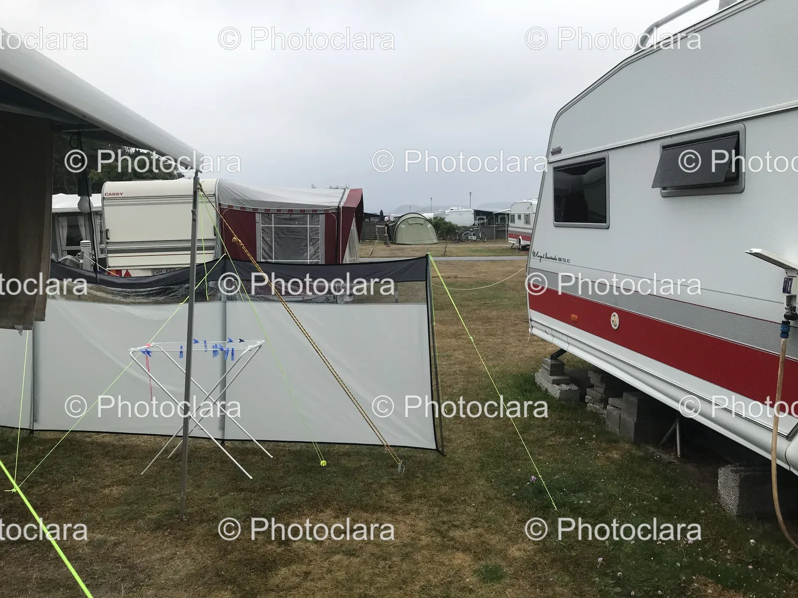 white-tent-beside-travel-trailer.jpg