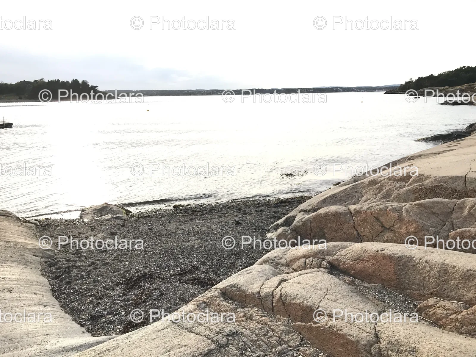 rocky-beach-calm-waters-serene-nature.jpg