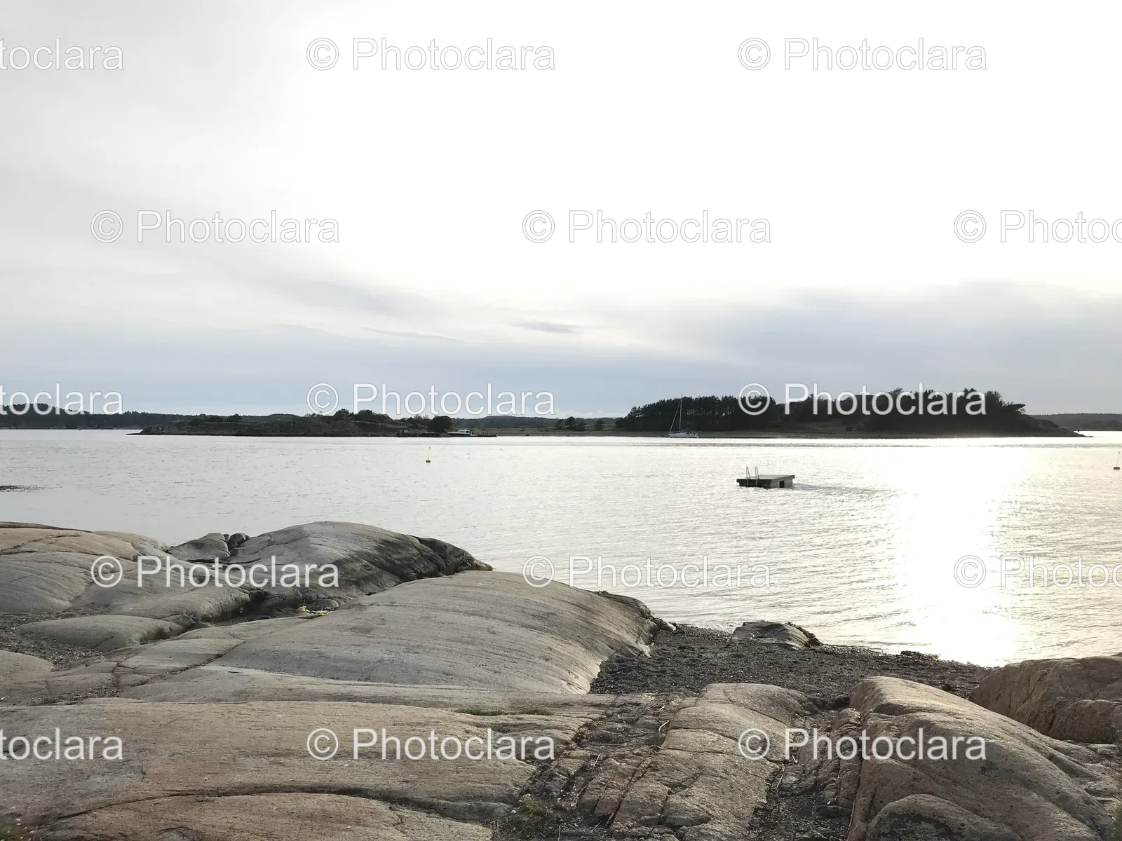 rocky-shore-boat-lake.jpg