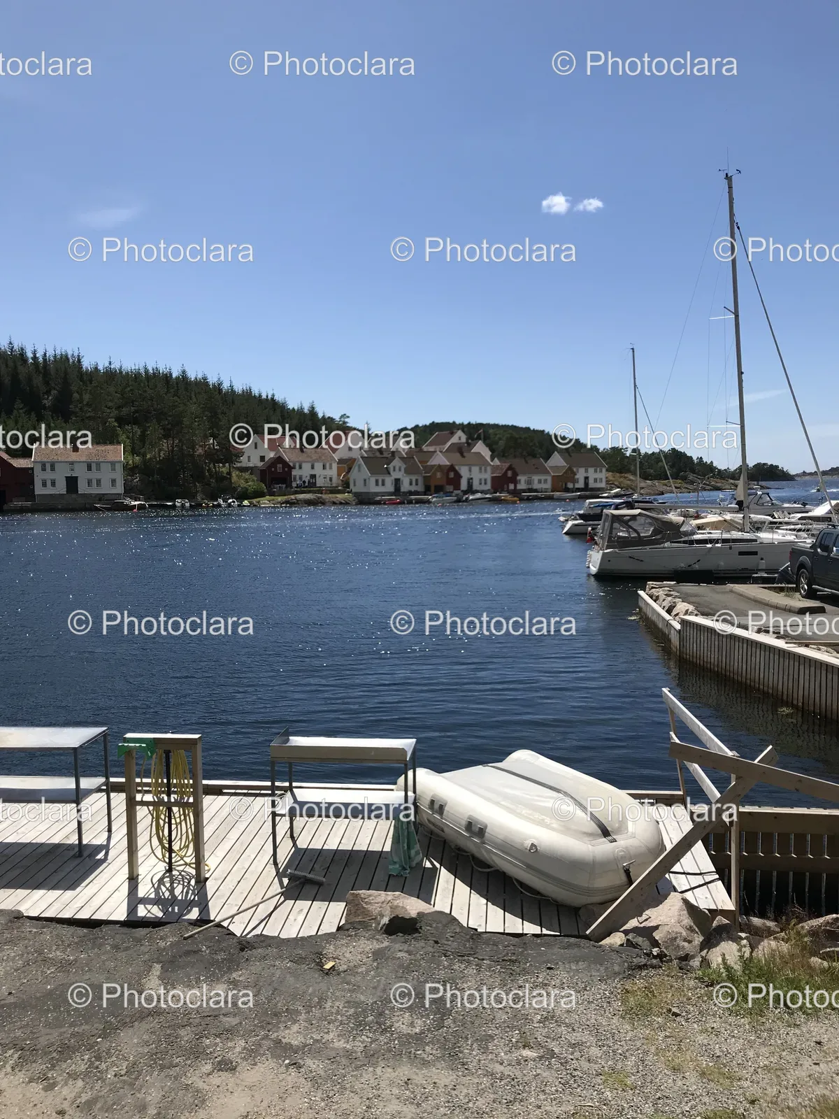 Boat-on-a-Dock-by-a-Lake.jpg