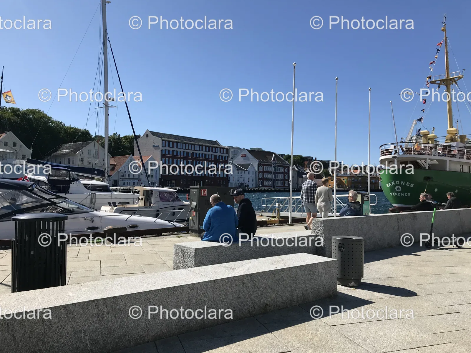 people-sitting-on-bench-water-sandnes-norway.jpg
