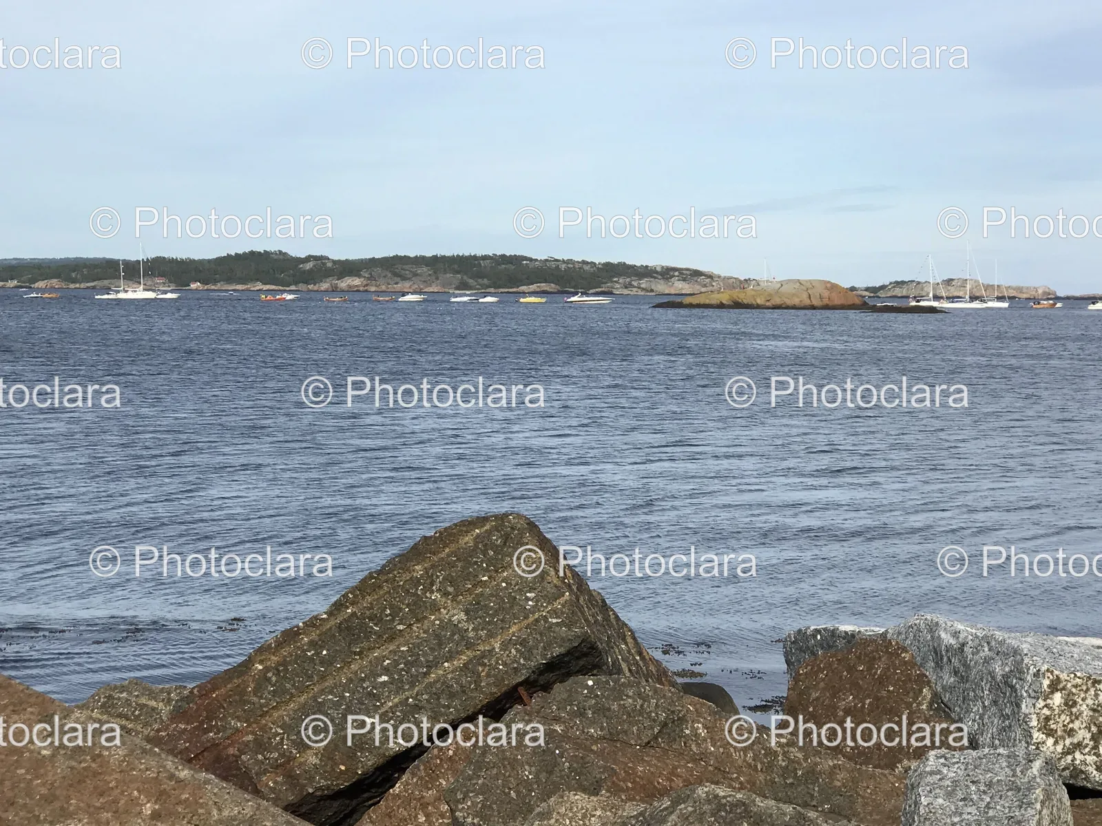rocky-shore-boats-water.jpg