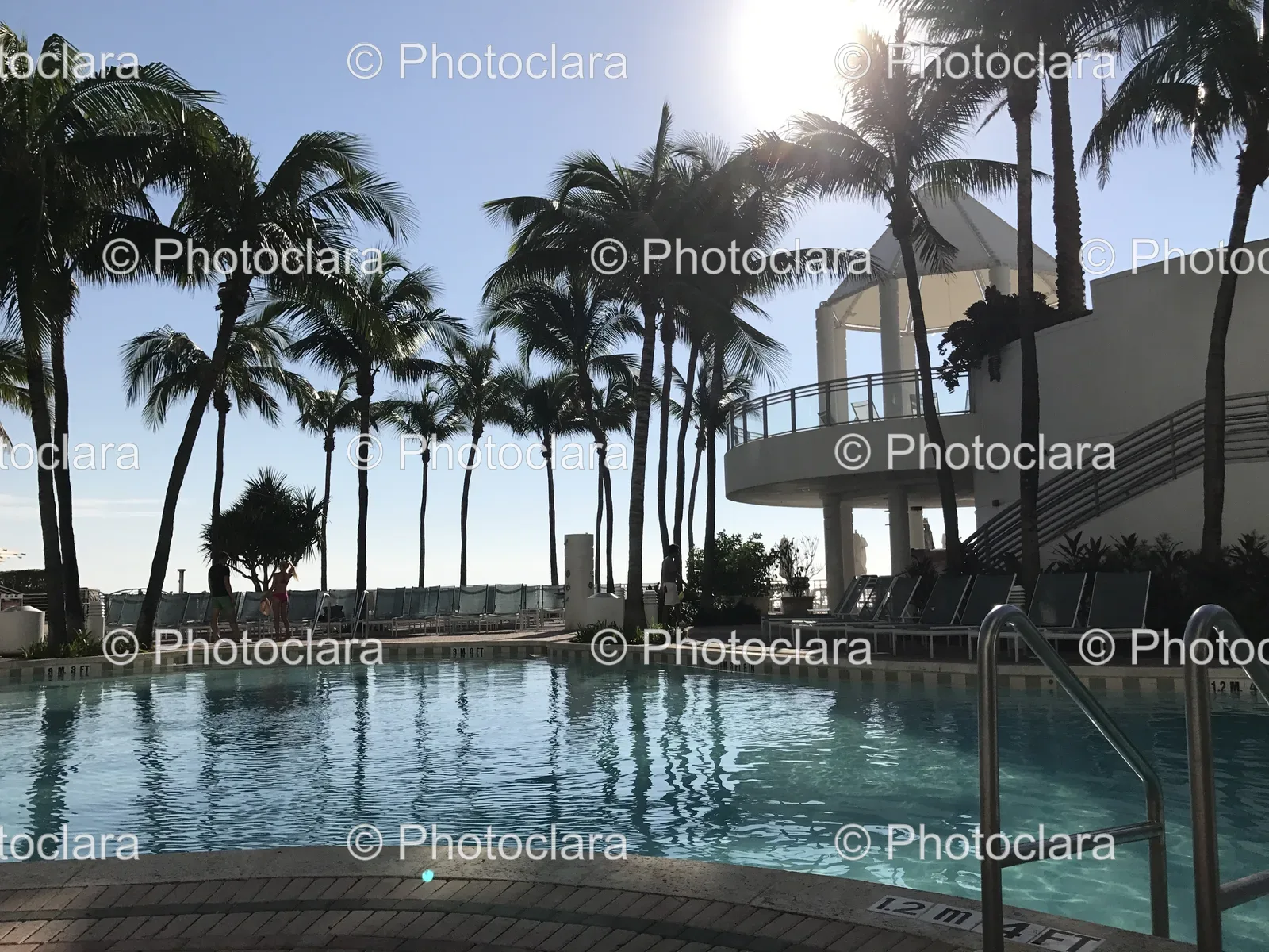 Serene-Poolside-with-Gazebo-and-Palm-Trees.jpg