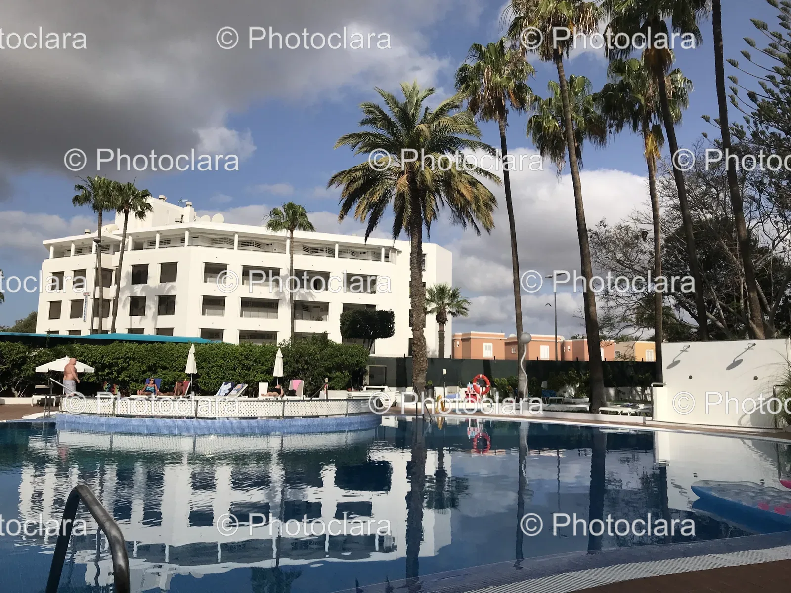 Serene-Poolside-with-Palm-Trees.jpg