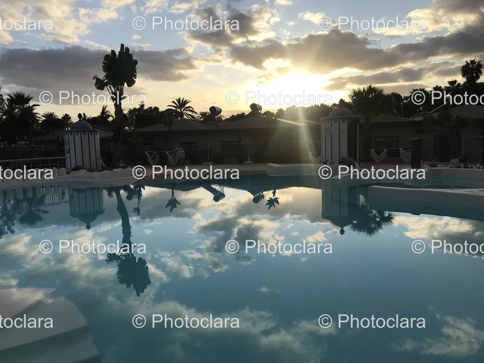 sun-drenched-pool-cloudy-skies.jpg
