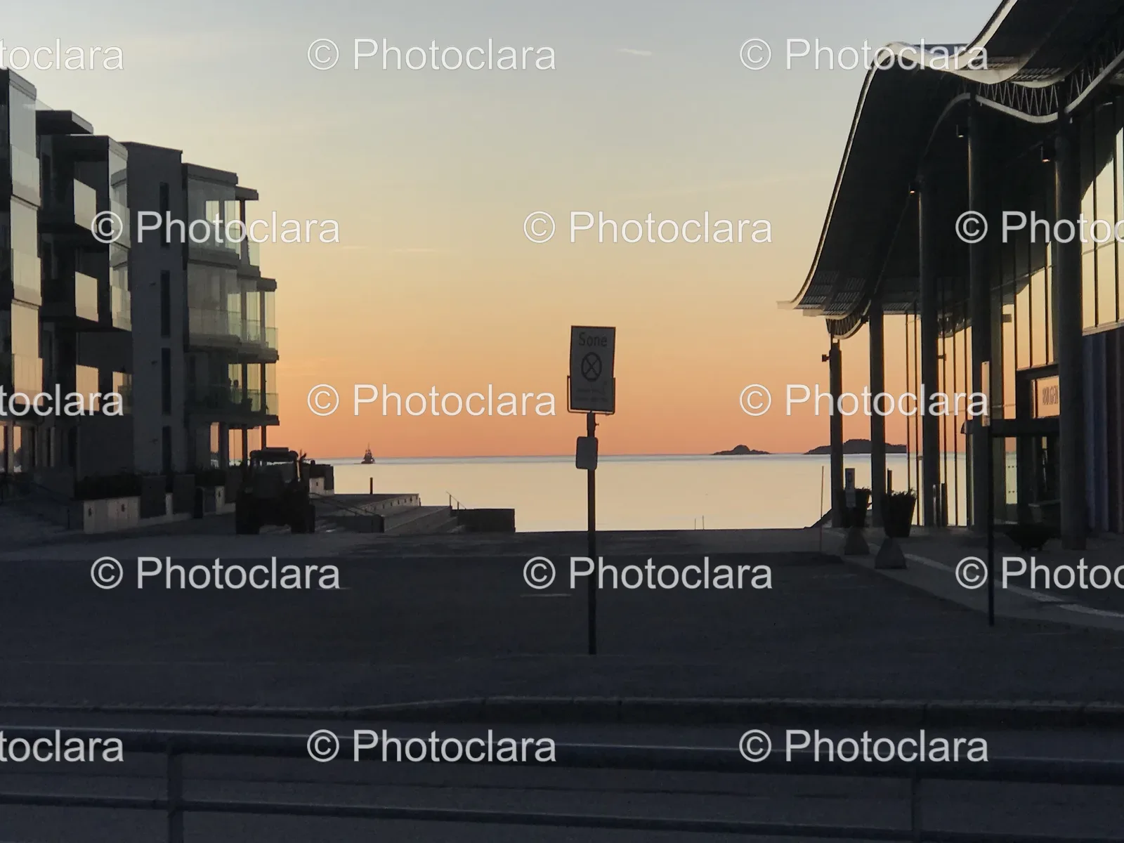 sunset-street-scene-with-water-and-buildings.jpg