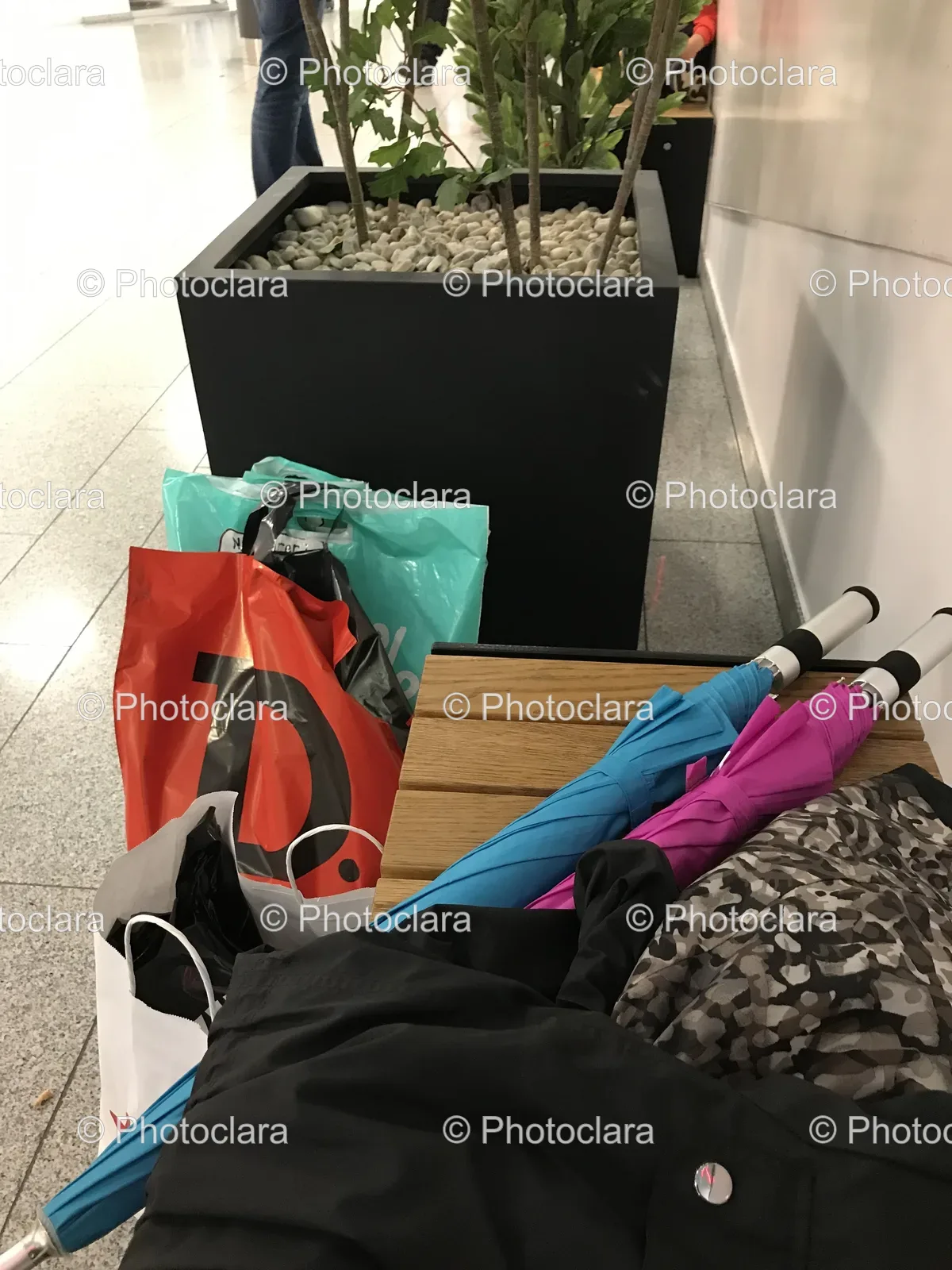 Umbrellas-and-Bags-on-a-Bench.jpg
