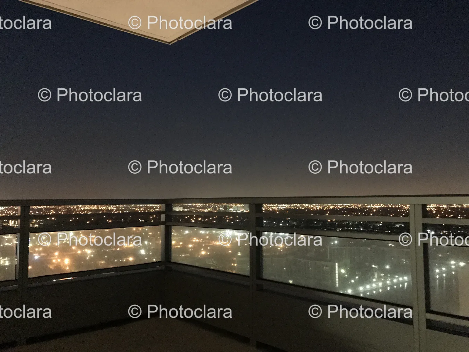 Balcony-Overlooking-City-At-Night.jpg