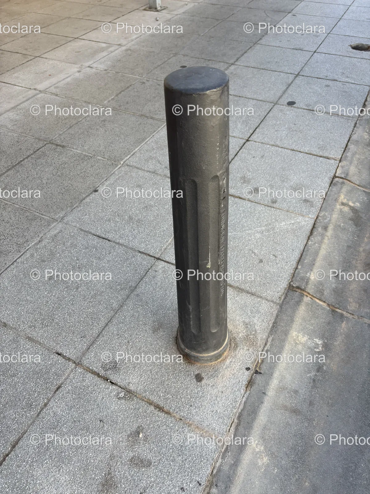 Black-Pole-on-City-Sidewalk.jpg
