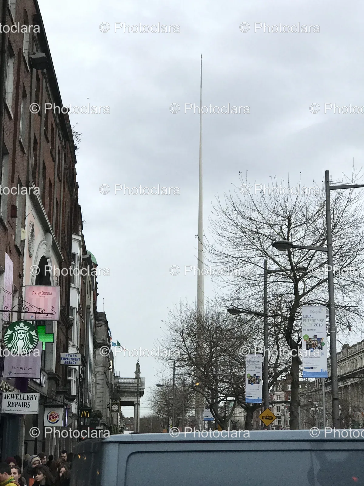 bustling-urban-street-buildings-tall-pole.jpg