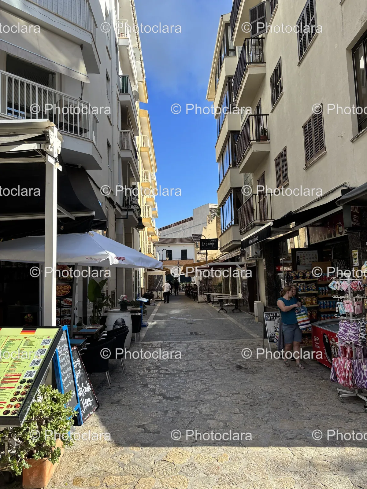 Lively-Urban-Street-with-Shops-and-Pedestrians.jpg