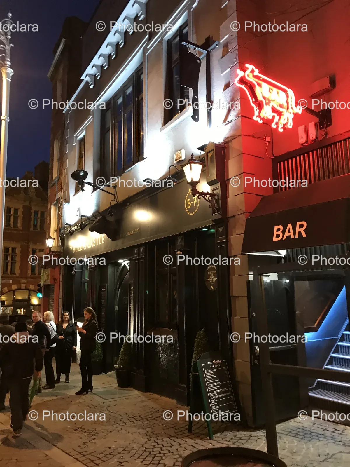 Group-of-People-Outside-a-Bar-at-Night.jpg