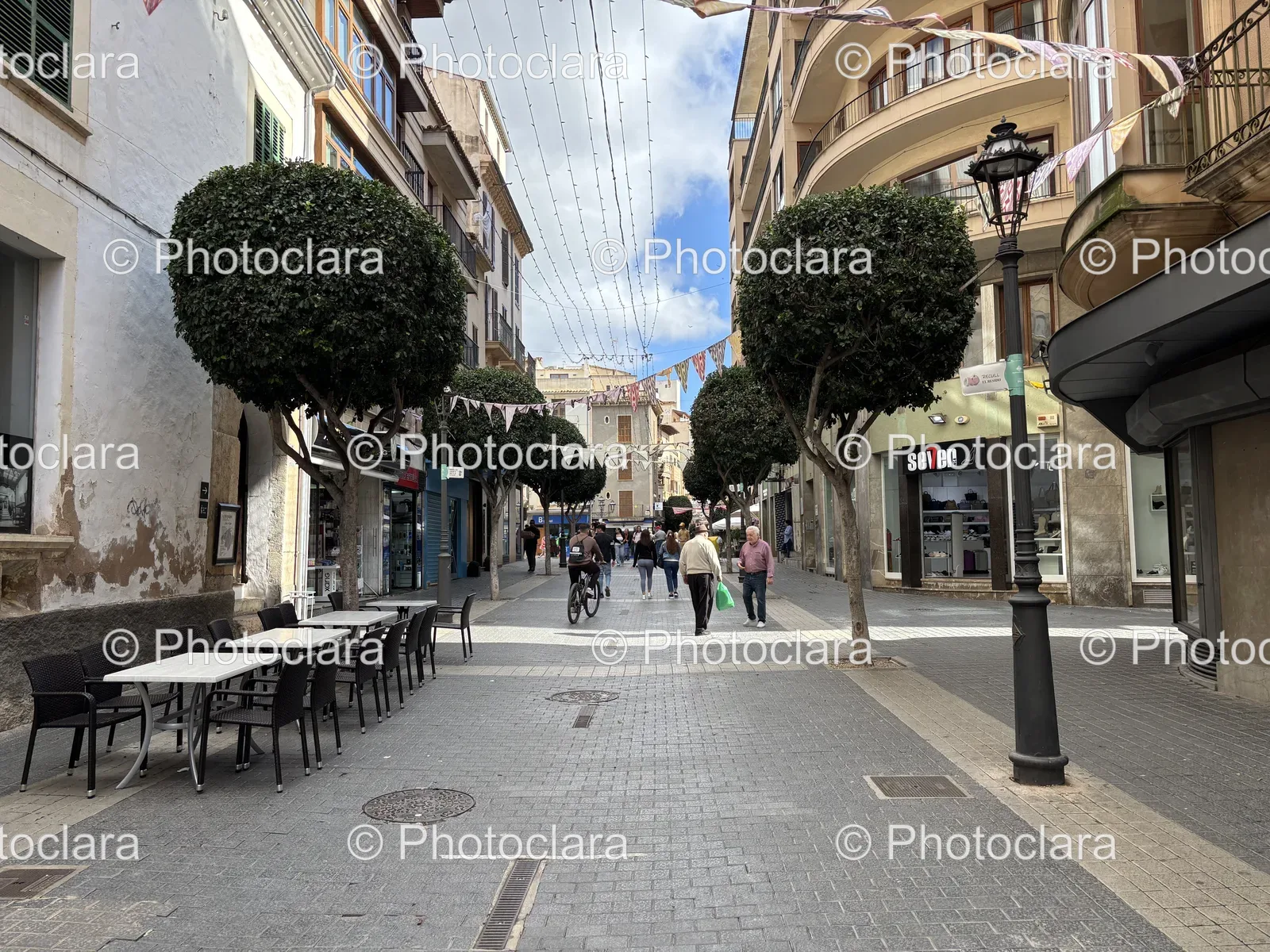Charming-Street-Cafe-with-Tables-and-Trees.jpg