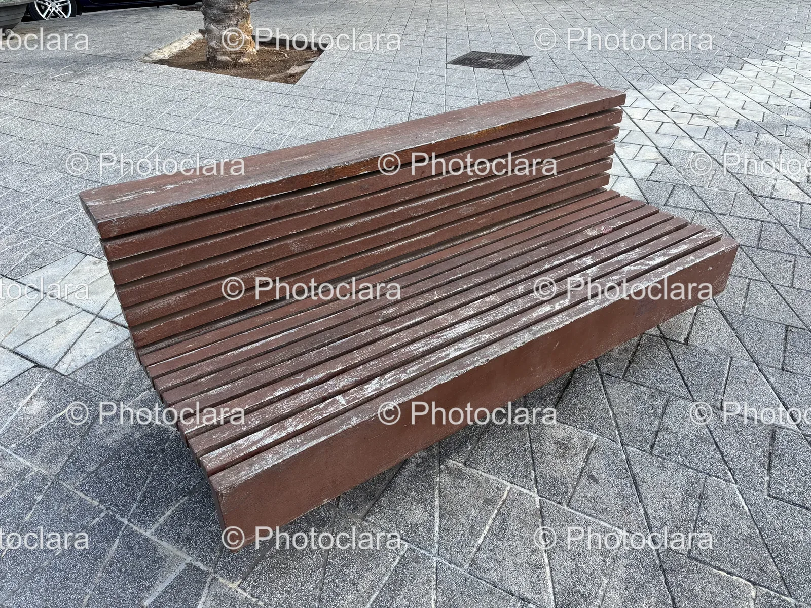 Tranquil-Wooden-Bench-on-Stone-Surface.jpg