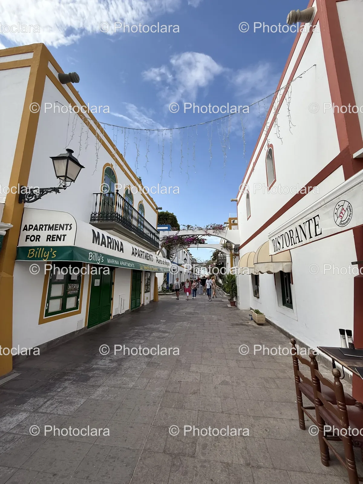 bustling-urban-street-apartments-restaurant-signs.jpg