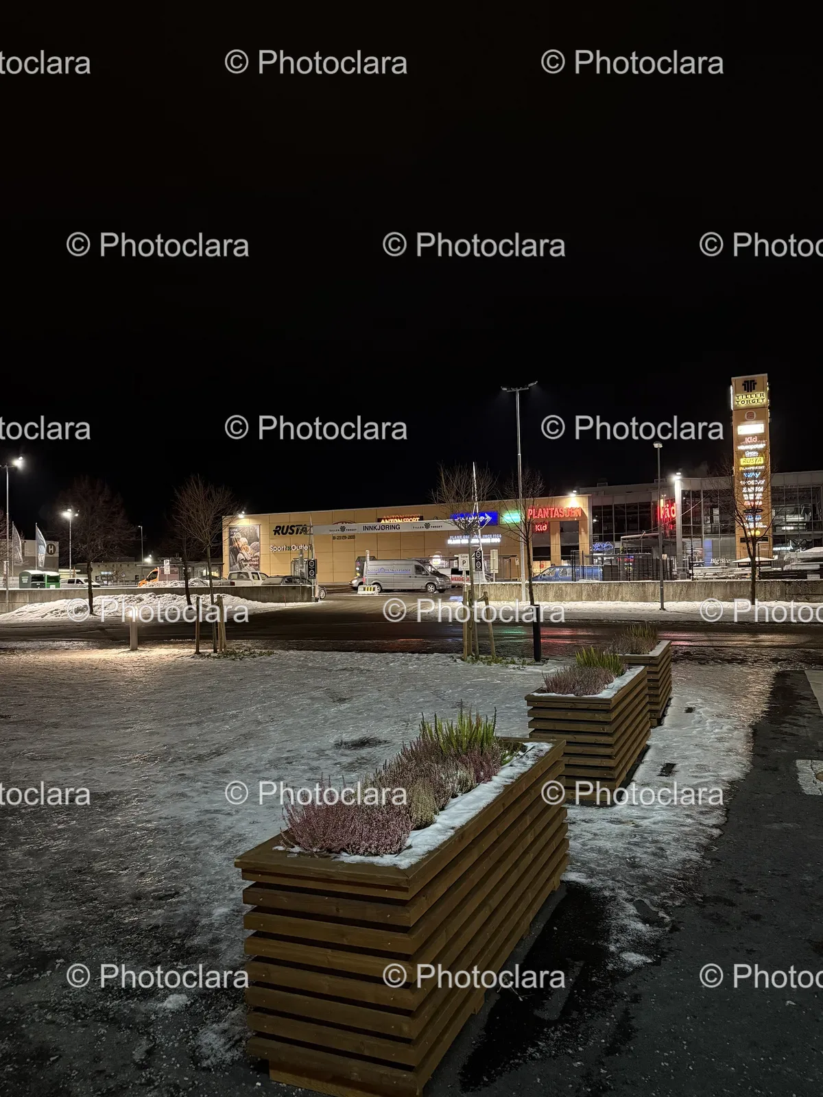 Snow-Covered-Parking-Lot-with-Building-and-Sign.jpg