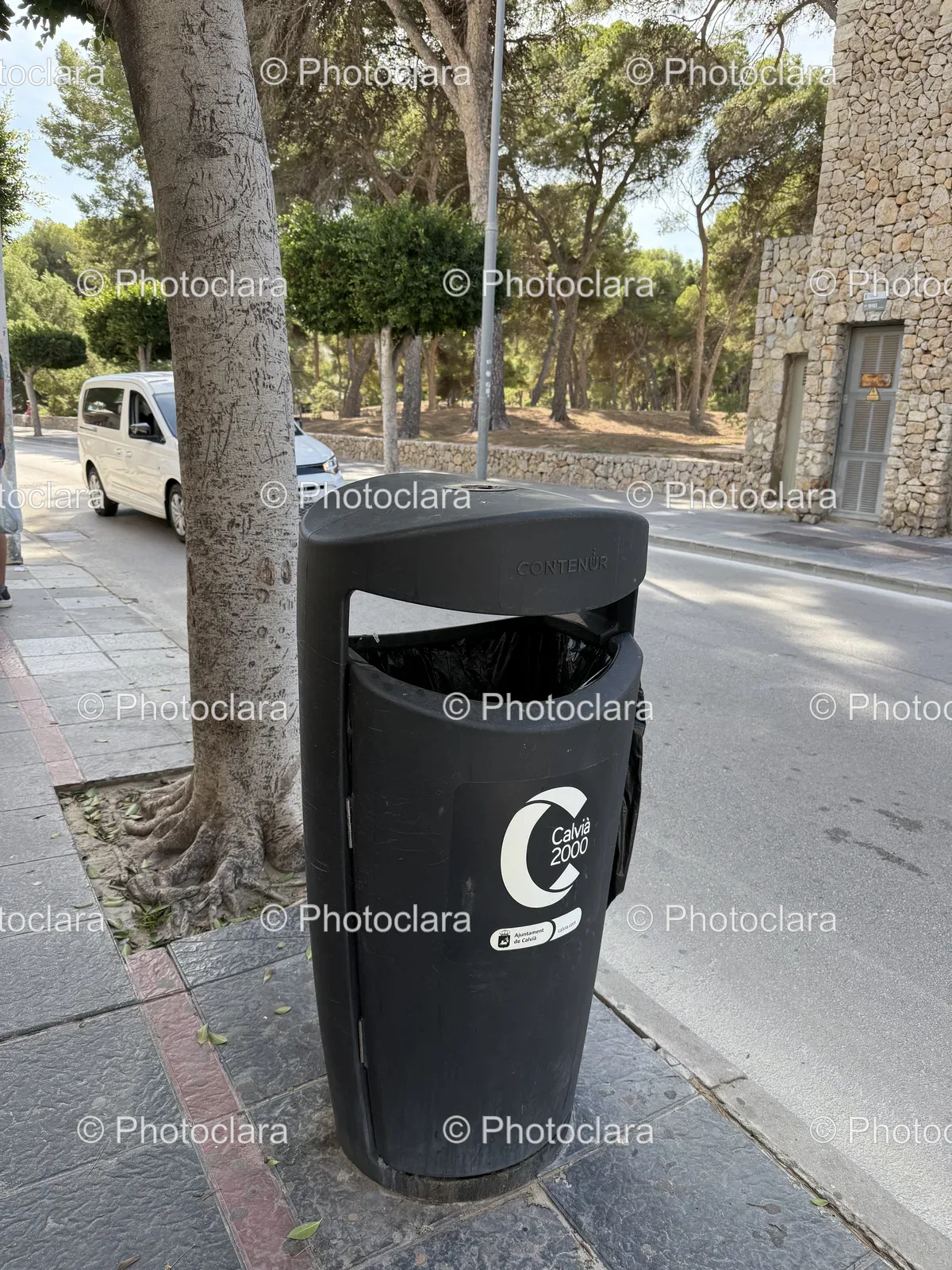 Black-Trash-Can-on-a-Sidewalk.jpg