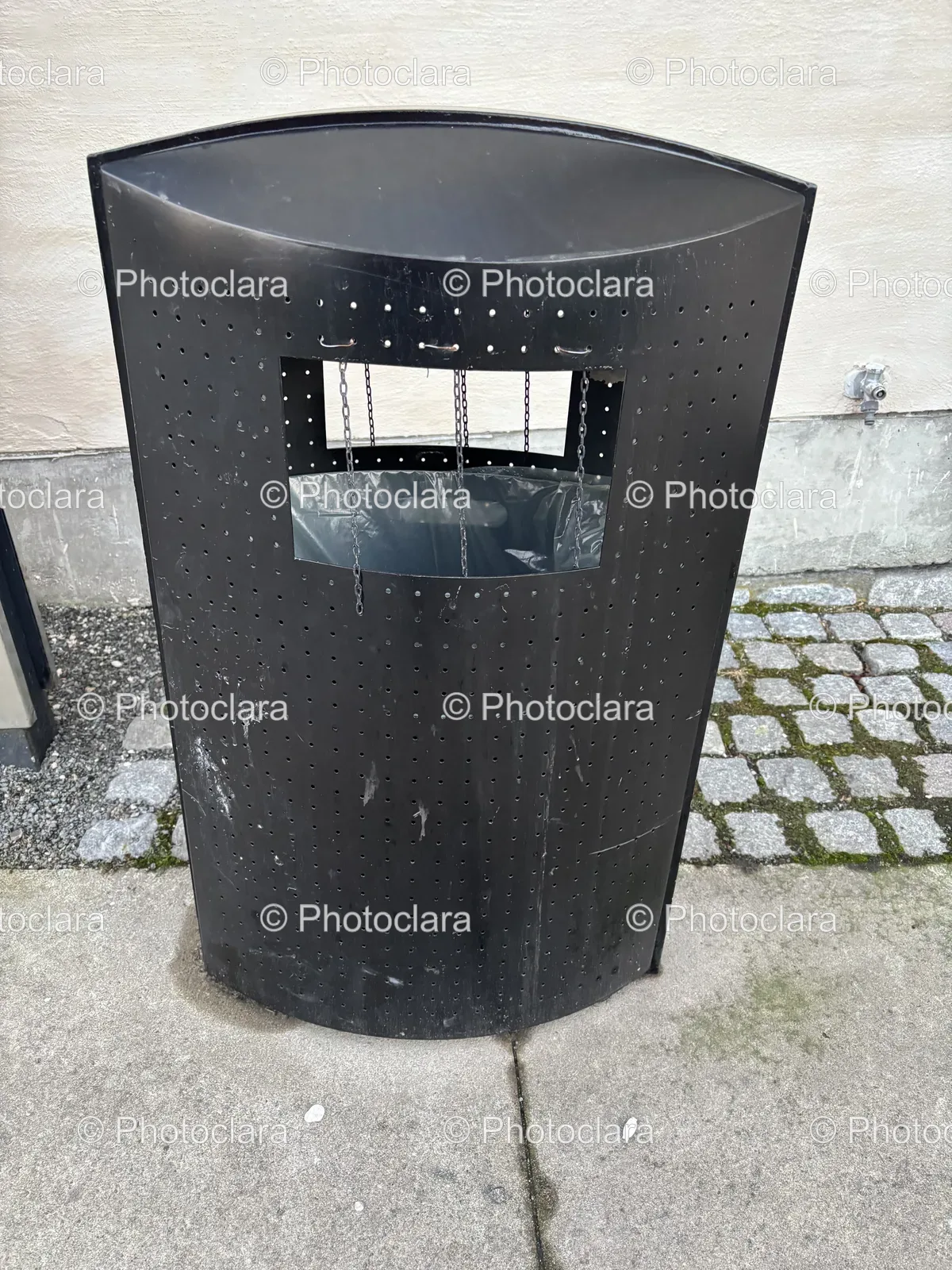 modern-black-trash-can-on-city-sidewalk.jpg