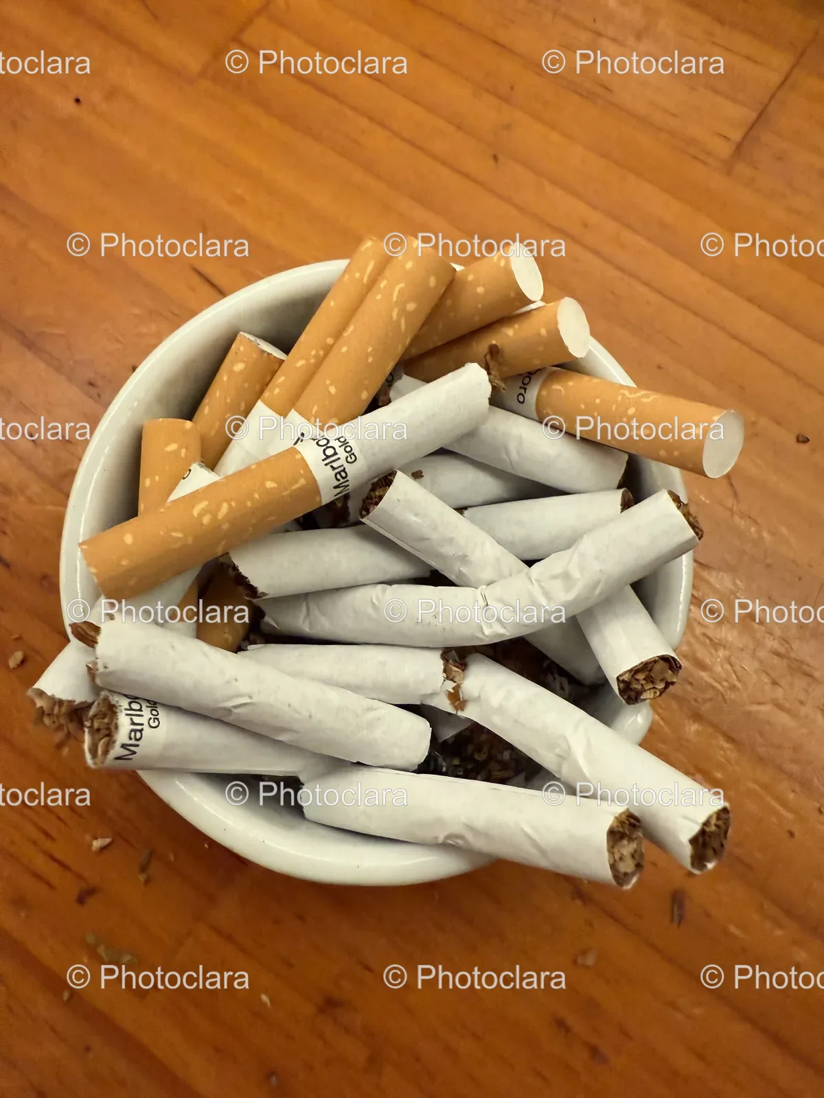 bowl-of-marlboro-gold-cigarettes-on-wooden-table.jpg